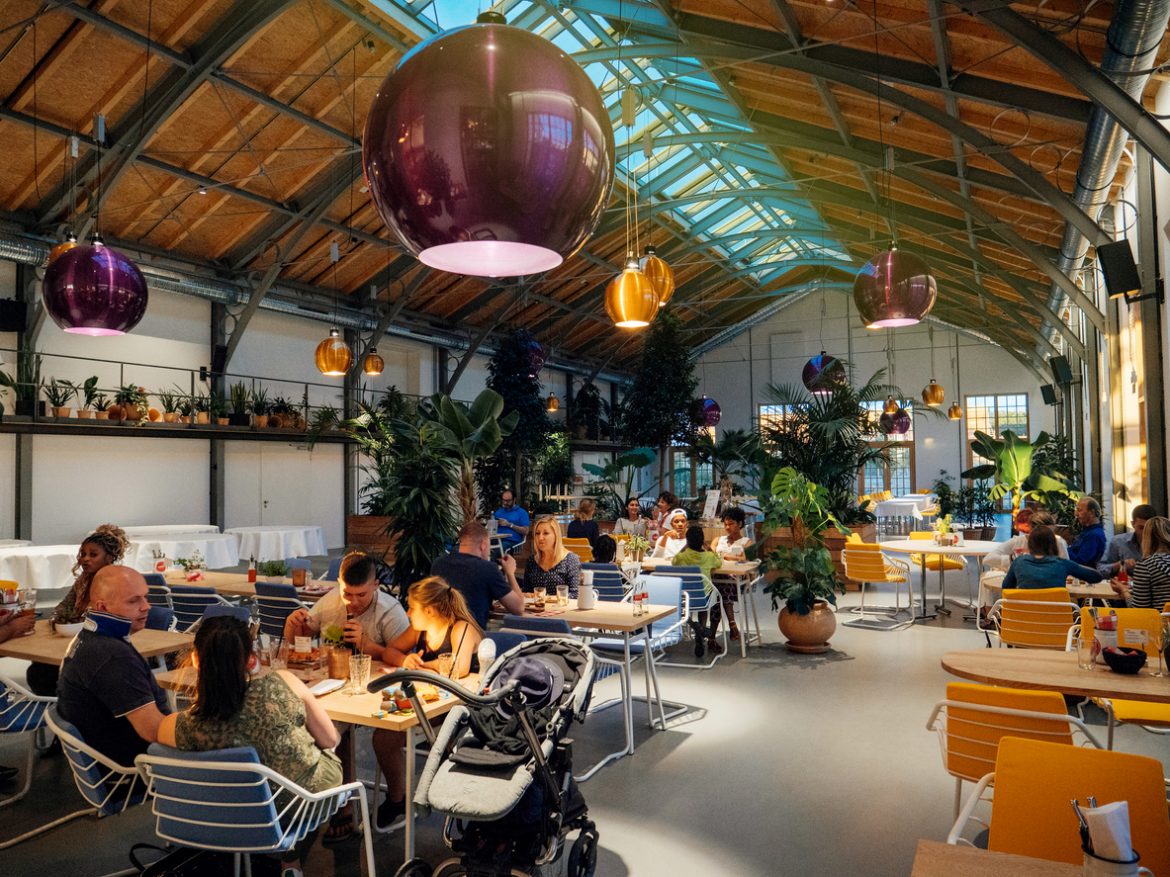 Large hall in restaurant eating food people